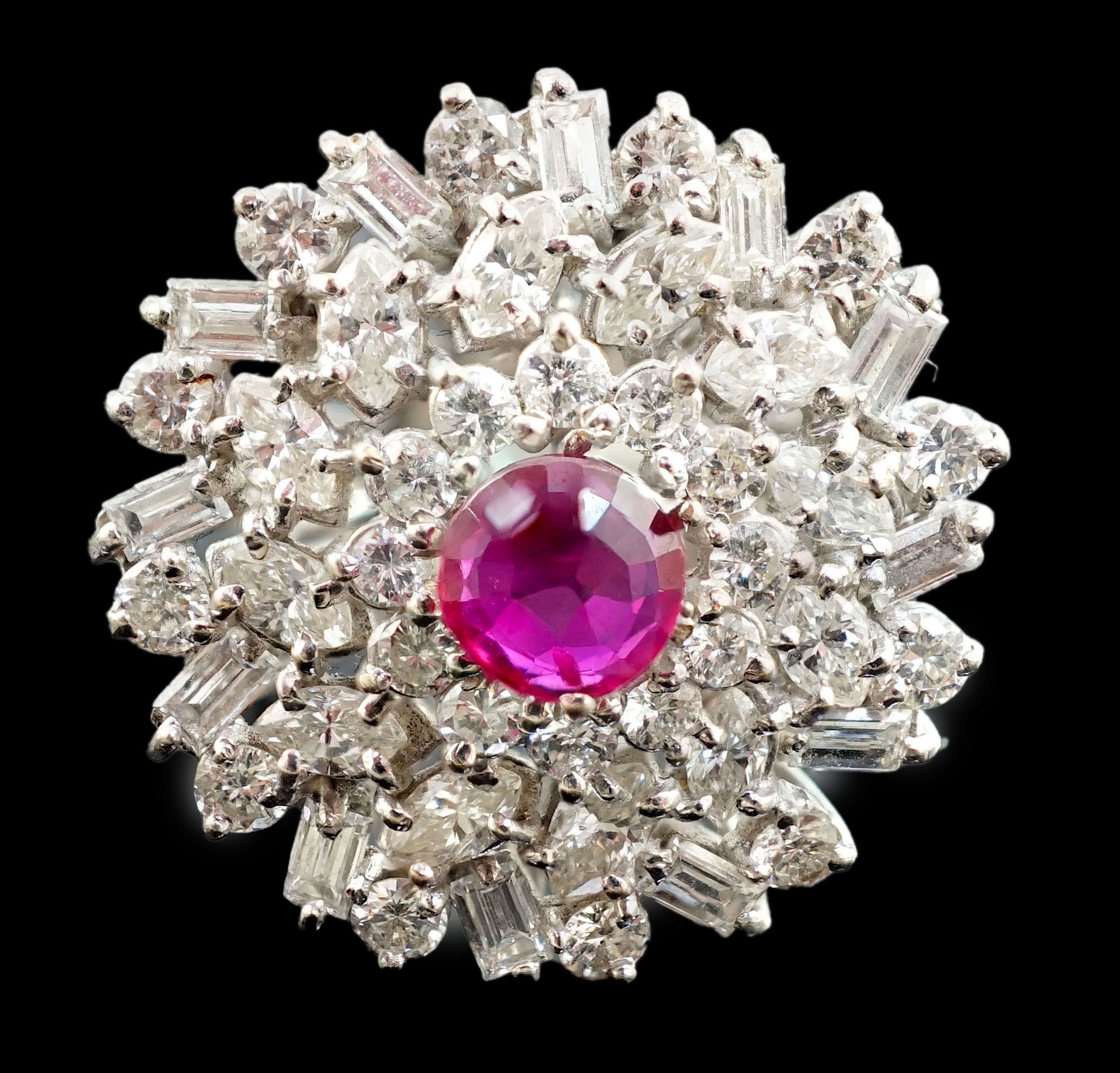 A modern 18ct white gold, ruby and round, baguette and marquise cut diamond cluster set dress ring